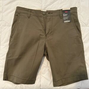Levis chino shorts size 30. Never worn still with tags. Color is olive green